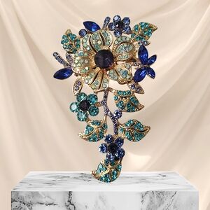 Elegant Floral Brooch with Blue and Gold Accents